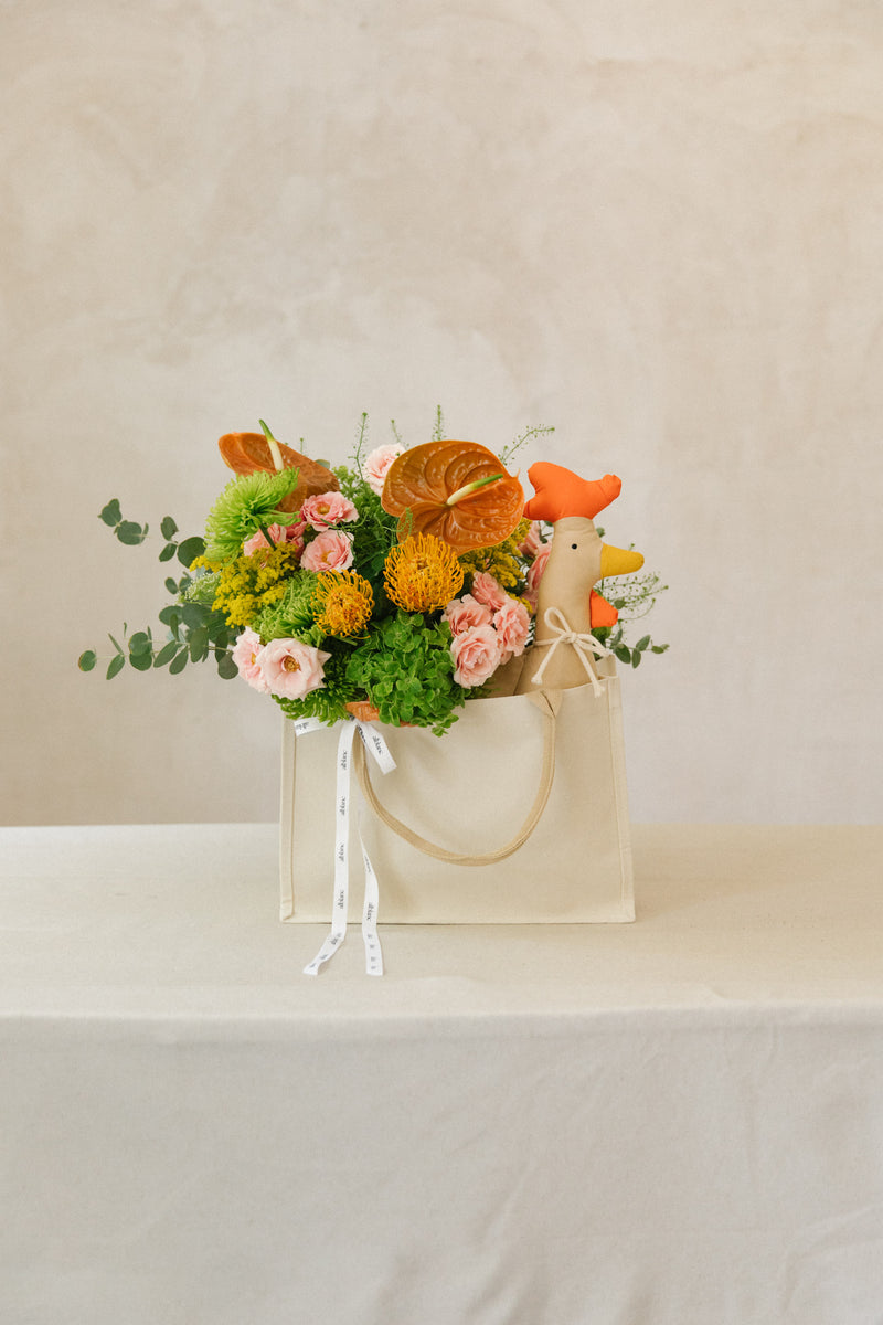 Bolsa de flores para recibir al nuevo bebé. Pack naranja y rosa