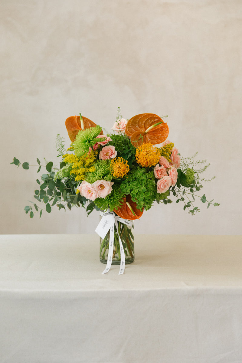 Bolsa de flores para recibir al nuevo bebé. Pack naranja y rosa